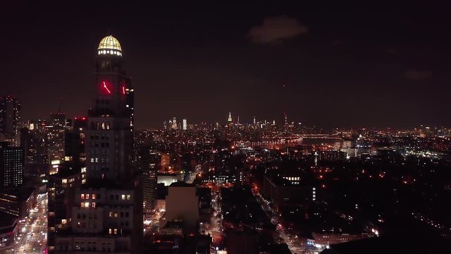 Drone footage of the Brooklyn and Manhattan city skyline at night, taken from Brooklyn New York.