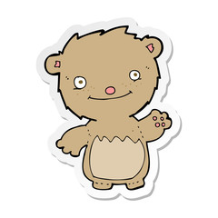 sticker of a cartoon waving teddy bear