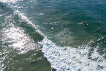Aerial view of a number of surfers at famous Bell's beach in Victoria, Australia