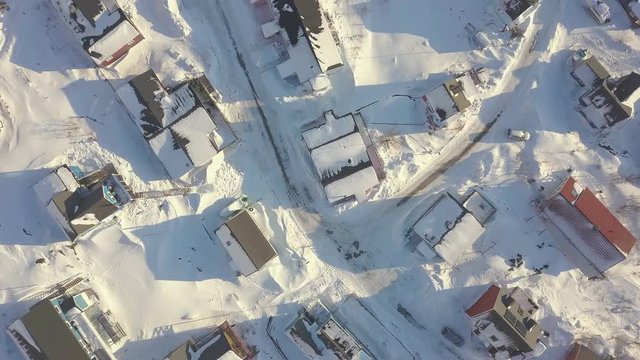 Snow town, colorful village in Covered with snow time aerial top roof view , qaqortoq south greenland europe