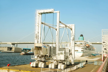 Yacht passenger gangway telescopic (boarding bridge) for pick up and drop off yacht passengers at Osaka port on bright blue sky background, is the main port in Japan, located in Osaka within Osaka Bay