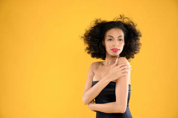 African American Woman Black Dress on Yellow Background