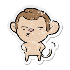 distressed sticker of a cartoon suspicious monkey