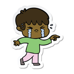 sticker of a cartoon boy crying