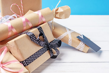 Handmade gift boxes on a white wooden background