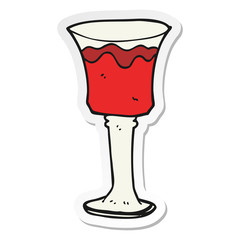 sticker of a cartoon goblet of wine