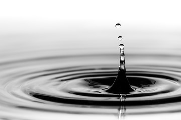 Water droplet splash background texture isolated on white. Fresh clean pure water ripples and...