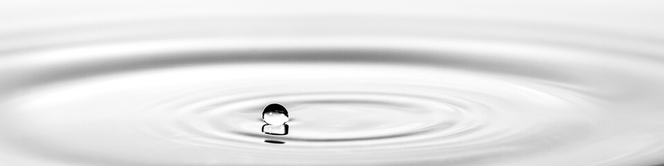 Water droplet splash background texture isolated on white. Fresh clean pure water ripples and...