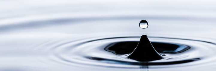 Water droplet splash background texture isolated on white. Fresh clean pure water ripples and...