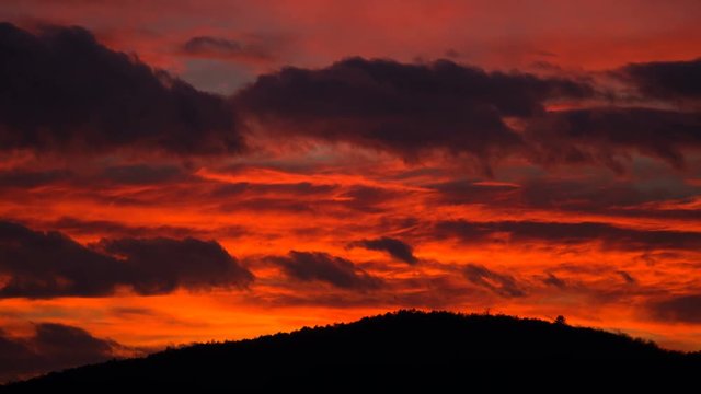 Red sunset sky nature timelapse. Otange light clouds background. Beautiful dramatic landscape time lapse.