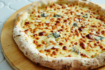 Cheese pizza with almond slice 