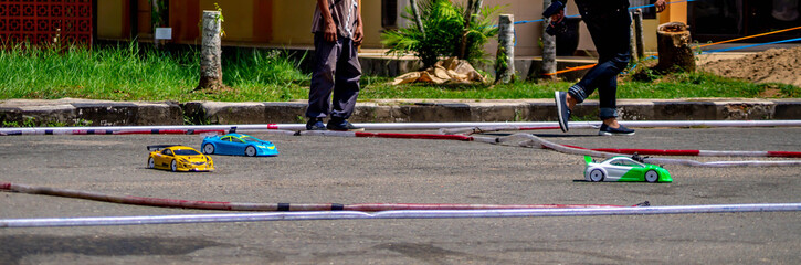 remote control car race competition on tarmac circuit