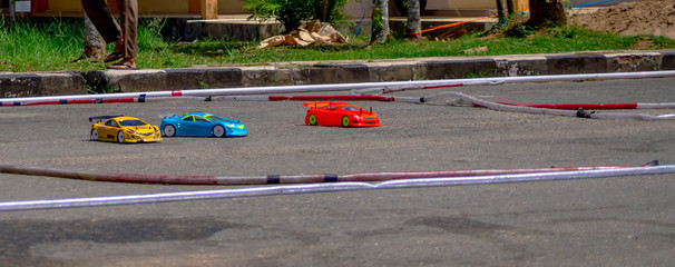 remote control car race competition on tarmac circuit