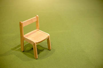 kids wood chair object on green carpet