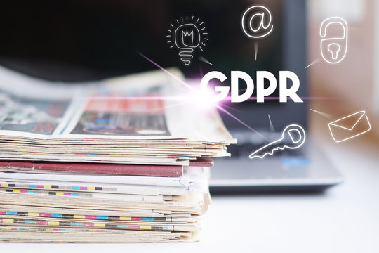 GDPR. Data Protection Regulation. Cyber security and privacy. Laptop and Newspapers, Concept for Different Sources of Information   