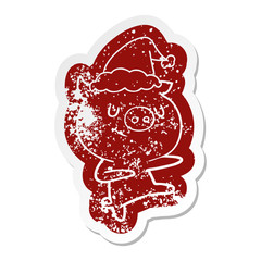happy cartoon distressed sticker of a pig dancing wearing santa hat