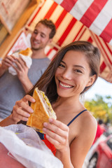Happy Asian girl eating cuban sandwich at local cafe restaurant in Key West, Florida. Summer travel...