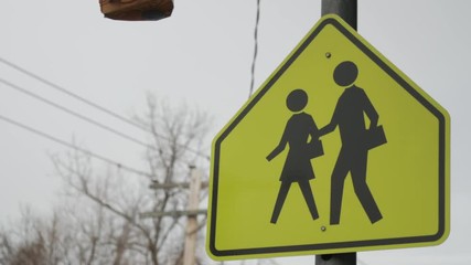 Close up of school crossing sign overcast