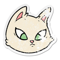 distressed sticker of a cartoon cat face