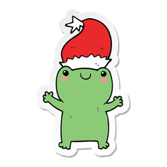 Obraz premium sticker of a cute christmas frog