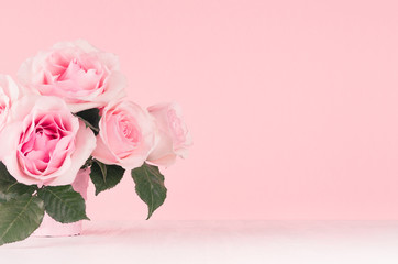 Fototapeta premium Girlish gentle flowers background - exquisite pink roses on white wood board, copy space.