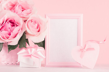 Romance festive mockup - delicate pastel pink flowers, gift box, heart with gentle ribbon and bow on white wooden table.