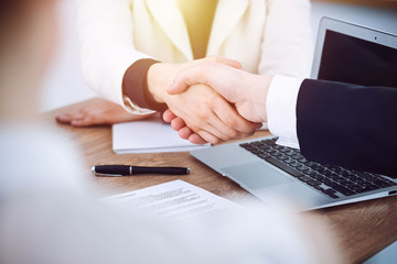 Business people shaking hands at meeting or negotiation in the office. Handshake concept. Partners are satisfied because signing contract