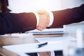 Obraz premium Business people shaking hands at meeting or negotiation in the office. Handshake concept. Partners are satisfied because signing contract