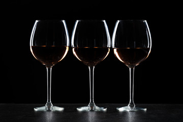 Glasses of wine in darkness