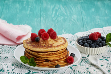 pancakes with fruit and maple syrup