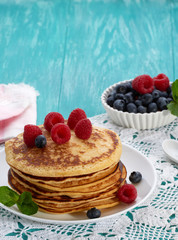 pancakes with fruit and maple syrup