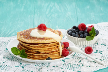 pancakes with fruit and maple syrup