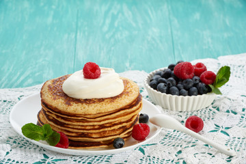 pancakes with fruit and maple syrup