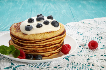 pancakes with fruit and maple syrup