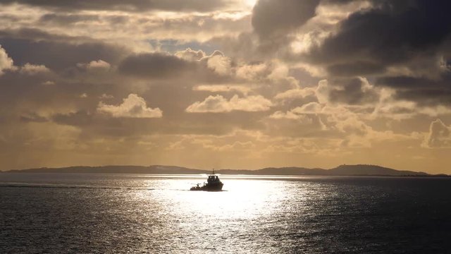 French tug ship silhouette sailing on Mediterranean sea