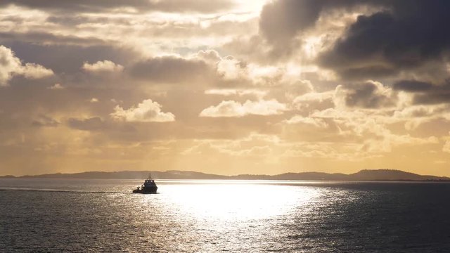 French tug ship silhouette sailing on Mediterranean sea