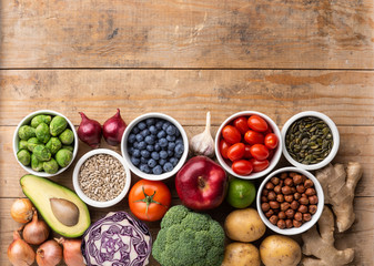 Healthy eating ingredients: fresh vegetables, fruits and superfood. Nutrition, diet, vegan food concept