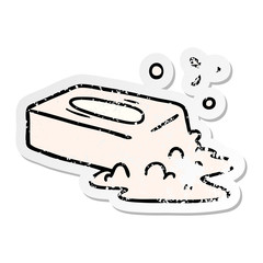 distressed sticker cartoon doodle of a bubbled soap