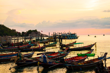 Silhouette sunset long tail boat colorful sky with cloud on beach at Koh Tao island