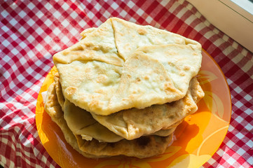 Fried tortillas on a rustic window on a towel