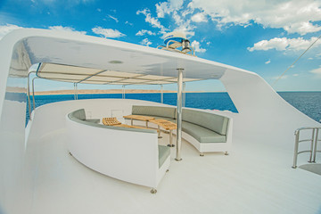 Table and chairs on sundeck of a luxury motor yacht