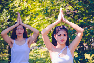 Group people have meditation for yoga.In the morning they are sitting on mat and play yoga in...