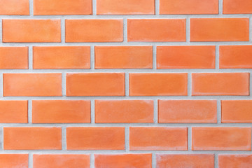 Red brick wall textured background.