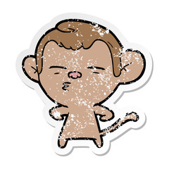 distressed sticker of a cartoon suspicious monkey