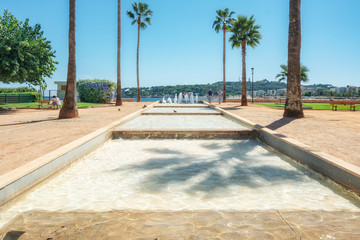 Pond with fountains located on the Antibes coastline