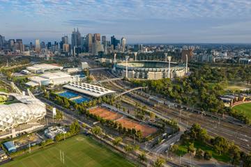 Fototapeta na wymiar Dawn view of the MCG and AAMI stadium, with the CBD in the background