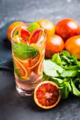 Mojito with red oranges. Selective focus. Shallow depth of field.