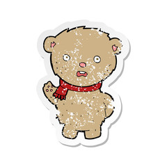 retro distressed sticker of a cartoon teddy bear wearing scarf