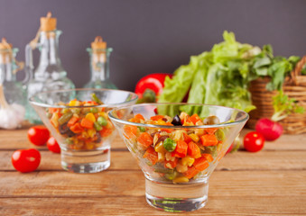Homemade Mexican salad in a bowls with beans, corn, tomato, pepper and other vegetables.