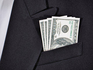 Close up banknote in suit pocket. Banknote One hundred dollar. 